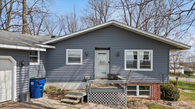 912 S 3rd Ave, Edgar, WI 54426 - view of front facade featuring a deck and driveway