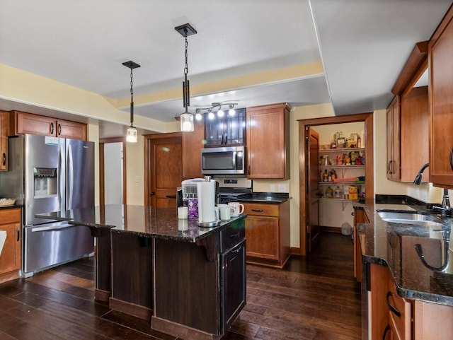 9318 W Mt Zion Dr, Milwaukee, WI 53224 - kitchen featuring stainless steel appliances, a sink, dark wood-style flooring, a kitchen island, and dark stone countertops