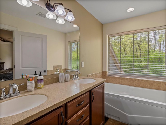 9318 W Mt Zion Dr, Milwaukee, WI 53224 - bathroom with a garden tub and double vanity