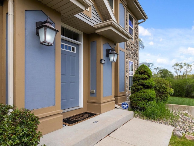 9318 W Mt Zion Dr, Milwaukee, WI 53224 - view of exterior entry with stone siding and stucco siding