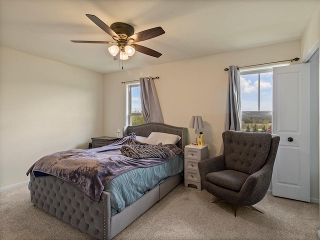 9318 W Mt Zion Dr, Milwaukee, WI 53224 - carpeted bedroom with multiple windows, ceiling fan, and baseboards