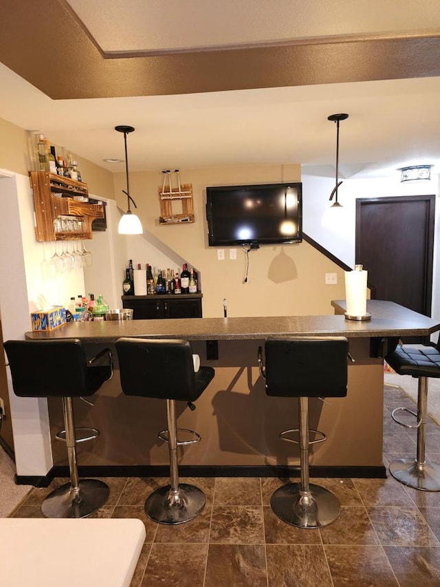 9318 W Mt Zion Dr, Milwaukee, WI 53224 - indoor wet bar featuring hanging light fixtures