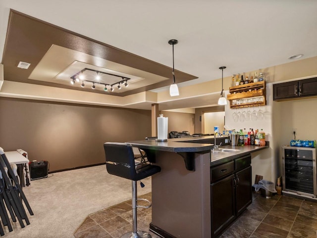 9318 W Mt Zion Dr, Milwaukee, WI 53224 - indoor bar with wine cooler, a tray ceiling, and decorative light fixtures