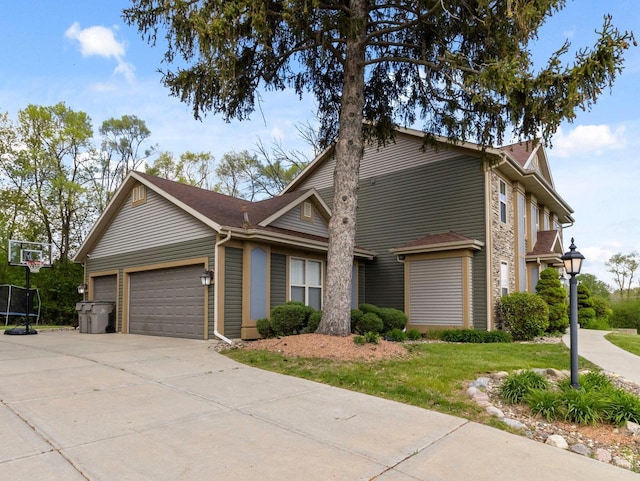 9318 W Mt Zion Dr, Milwaukee, WI 53224 - view of front of home with an attached garage, concrete driveway, and a front lawn