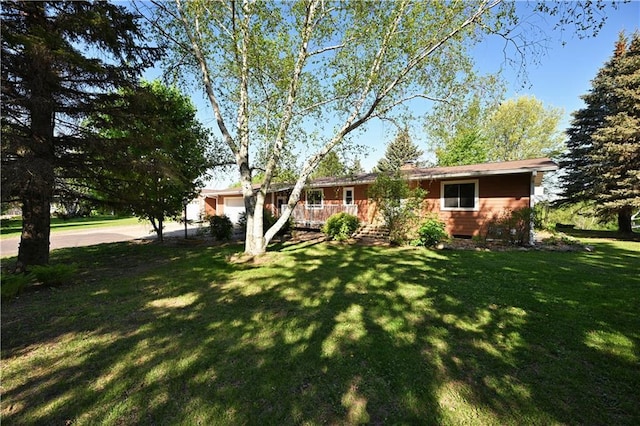 811 Russell St, Grantsburg, WI 54840 - view of front of property with a garage and a front lawn
