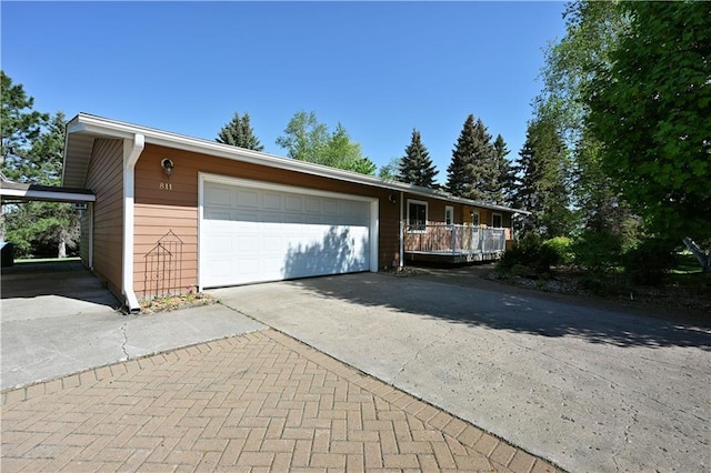 811 Russell St, Grantsburg, WI 54840 - view of front facade featuring asphalt driveway and an attached garage