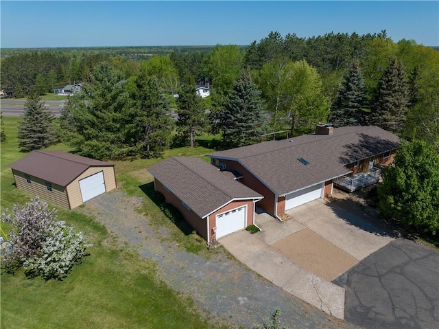 811 Russell St, Grantsburg, WI 54840 - aerial view of property and surrounding area featuring a heavily wooded area
