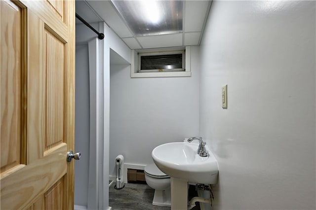 811 Russell St, Grantsburg, WI 54840 - bathroom featuring wood finished floors, toilet, and baseboards