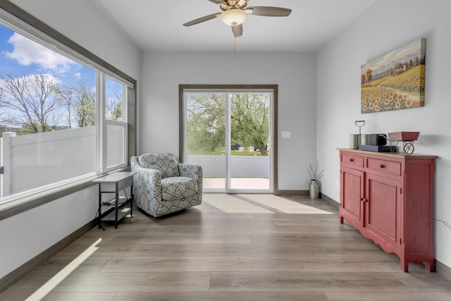 3153 Lazy Oak Ct, Green Bay, WI 54311 - sitting room featuring ceiling fan, light wood finished floors, and baseboards