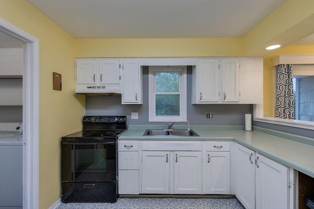 14 S 3rd St, Darien, WI 53114 - kitchen with black range with electric cooktop, a sink, washer / dryer, and white cabinets