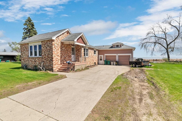 ranch-style house featuring a front yard, concrete driveway, a garage, and brick siding