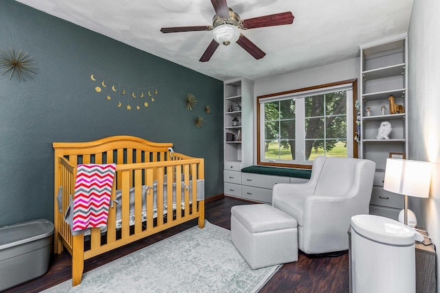 11915 Wedgewood Ln, Darlington, WI 53530 - bedroom featuring a crib, wood finished floors, and ceiling fan