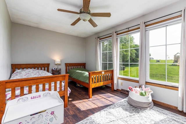 11915 Wedgewood Ln, Darlington, WI 53530 - bedroom featuring baseboards, wood finished floors, and a ceiling fan