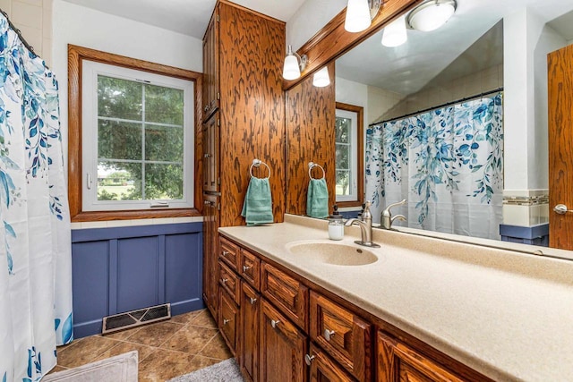 11915 Wedgewood Ln, Darlington, WI 53530 - full bath with vanity, tile patterned floors, and curtained shower