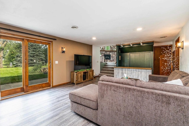 11915 Wedgewood Ln, Darlington, WI 53530 - living room with wood finished floors, baseboards, and recessed lighting