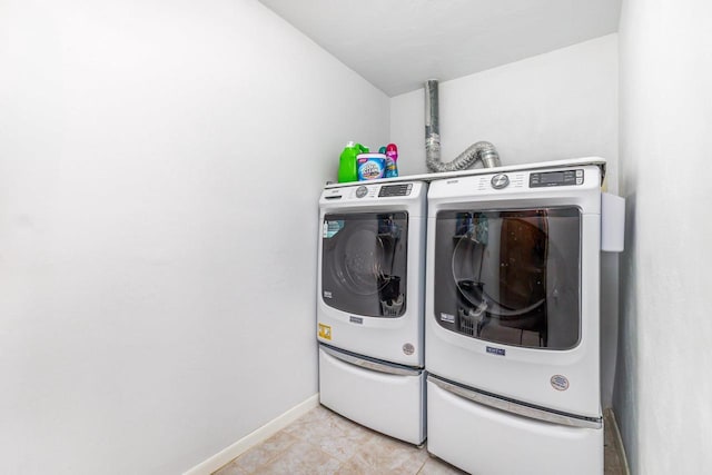 11915 Wedgewood Ln, Darlington, WI 53530 - washroom with washing machine and dryer and baseboards