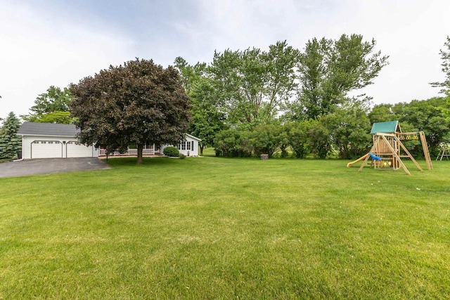11915 Wedgewood Ln, Darlington, WI 53530 - view of grassy yard featuring a playground