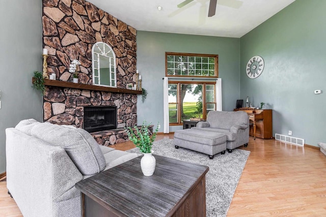 11915 Wedgewood Ln, Darlington, WI 53530 - living room with ceiling fan, wood finished floors, a fireplace, and baseboards