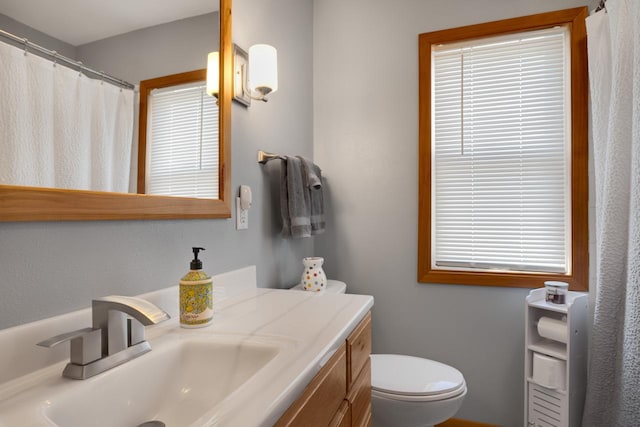 N75W15747 Colony Rd, Menomonee Falls, WI 53051 - bathroom with vanity, toilet, and curtained shower
