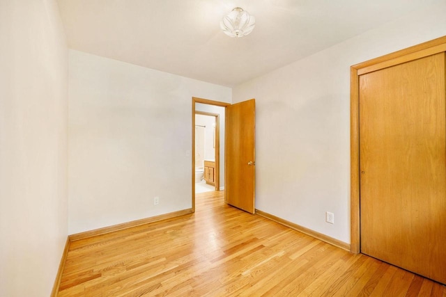 605 Douglas Trl, Madison, WI 53716 - unfurnished bedroom featuring light wood-type flooring, baseboards, and a closet