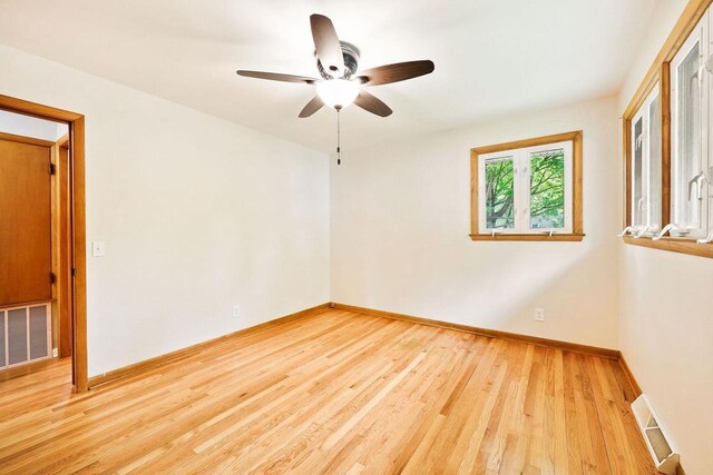 605 Douglas Trl, Madison, WI 53716 - unfurnished room with wood finished floors, ceiling fan, and baseboards