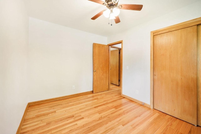 605 Douglas Trl, Madison, WI 53716 - unfurnished bedroom with wood finished floors, a closet, a ceiling fan, and baseboards