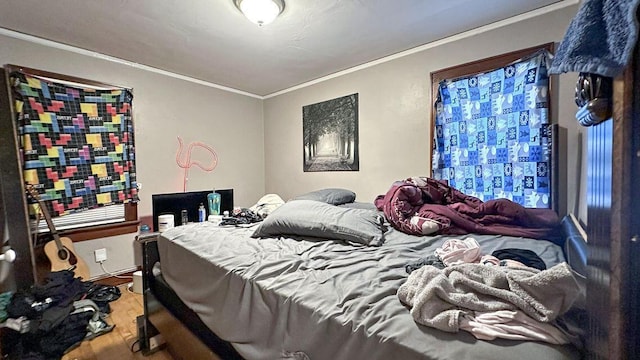 5561 N 40th St, Milwaukee, WI 53209 - bedroom featuring wood finished floors and crown molding