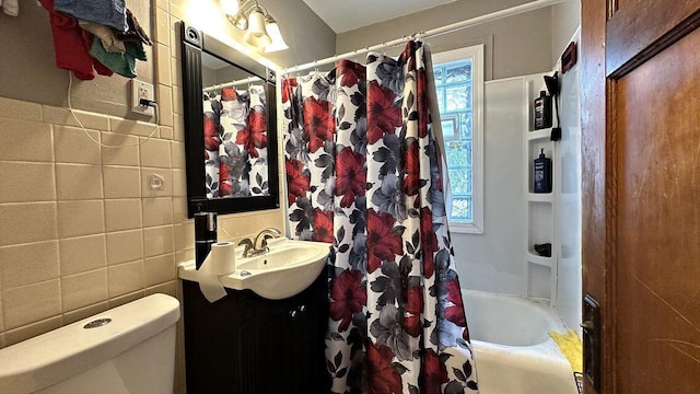 5561 N 40th St, Milwaukee, WI 53209 - bathroom with toilet, tile walls, and vanity