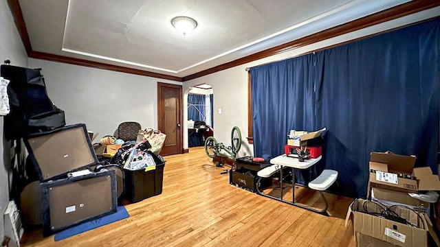 5561 N 40th St, Milwaukee, WI 53209 - rec room featuring hardwood / wood-style flooring, a raised ceiling, and crown molding