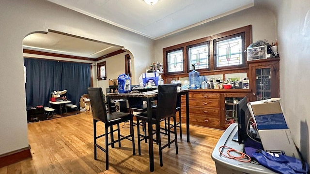 5561 N 40th St, Milwaukee, WI 53209 - dining room with ornamental molding, arched walkways, and wood finished floors