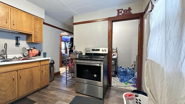 5561 N 40th St, Milwaukee, WI 53209 - kitchen with electric stove, wood finished floors, a sink, and light countertops