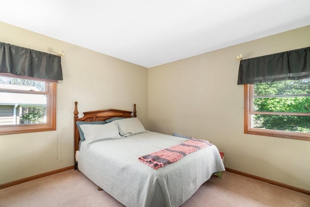 bedroom featuring carpet floors and baseboards