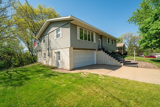 split foyer home with an attached garage, brick siding, driveway, a front lawn, and stairs