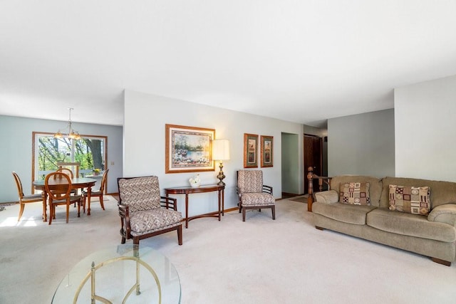 living area featuring light colored carpet and a chandelier