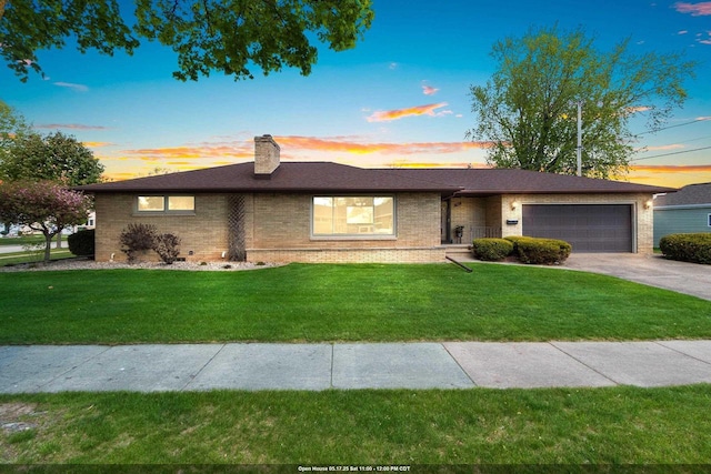 1020 W 3rd St, Kimberly, WI 54136 - ranch-style house with a garage, brick siding, a lawn, and concrete driveway
