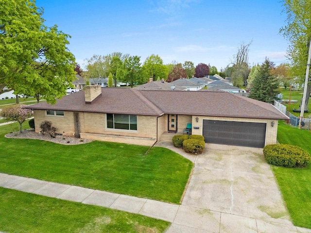 1020 W 3rd St, Kimberly, WI 54136 - single story home featuring an attached garage, driveway, brick siding, a front lawn, and a chimney