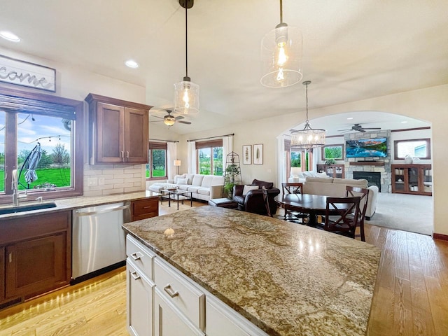 5634 Wind Dancer Ct, Sheboygan, WI 53081 - kitchen featuring dishwasher, ceiling fan, arched walkways, open floor plan, and recessed lighting
