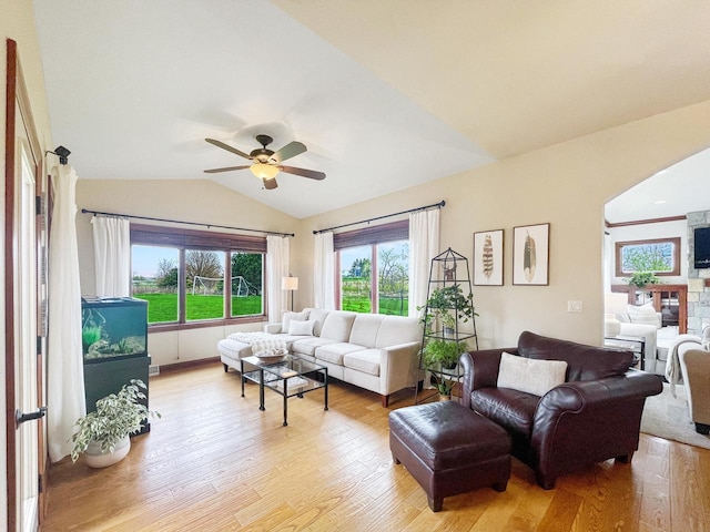 5634 Wind Dancer Ct, Sheboygan, WI 53081 - living area with a ceiling fan, vaulted ceiling, plenty of natural light, and light wood-style flooring