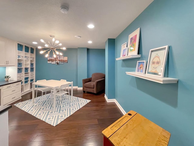 5634 Wind Dancer Ct, Sheboygan, WI 53081 - dining space featuring recessed lighting, a chandelier, dark wood-style flooring, and baseboards