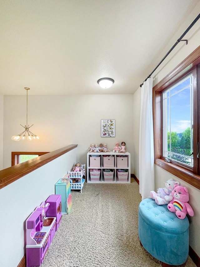 5634 Wind Dancer Ct, Sheboygan, WI 53081 - rec room with a chandelier, carpet flooring, and baseboards