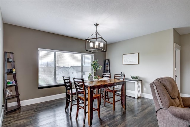 1215 Brooke Ct, Chippewa Falls, WI 54729 - dining room featuring a chandelier, dark wood-style floors, and baseboards