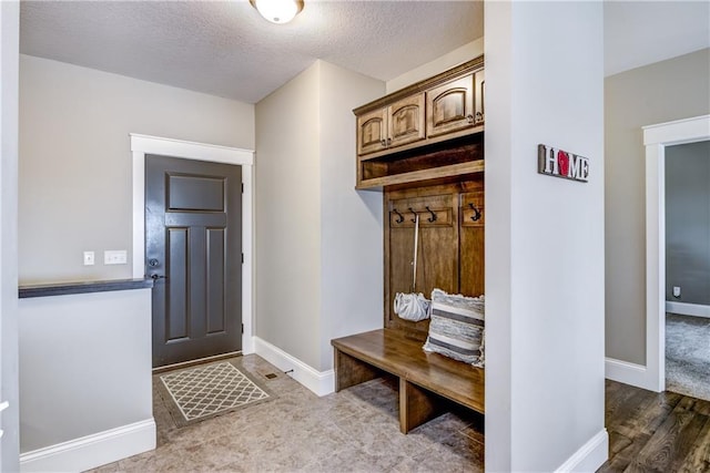 1215 Brooke Ct, Chippewa Falls, WI 54729 - mudroom featuring baseboards and a textured ceiling