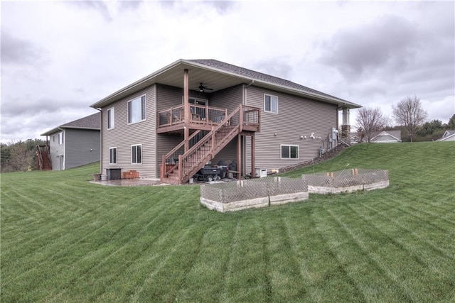 1215 Brooke Ct, Chippewa Falls, WI 54729 - back of property featuring stairway, a ceiling fan, a yard, and a wooden deck