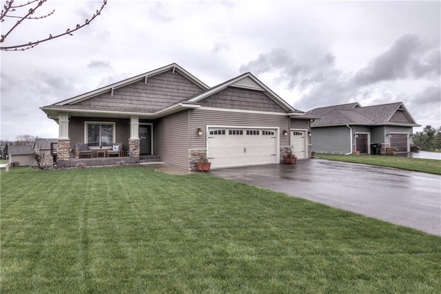 1215 Brooke Ct, Chippewa Falls, WI 54729 - craftsman-style house featuring driveway, an attached garage, a front lawn, and a porch