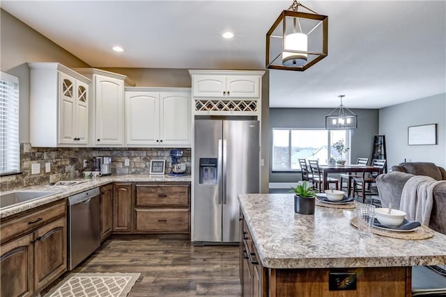 1215 Brooke Ct, Chippewa Falls, WI 54729 - kitchen with appliances with stainless steel finishes, dark wood-type flooring, white cabinetry, pendant lighting, and recessed lighting