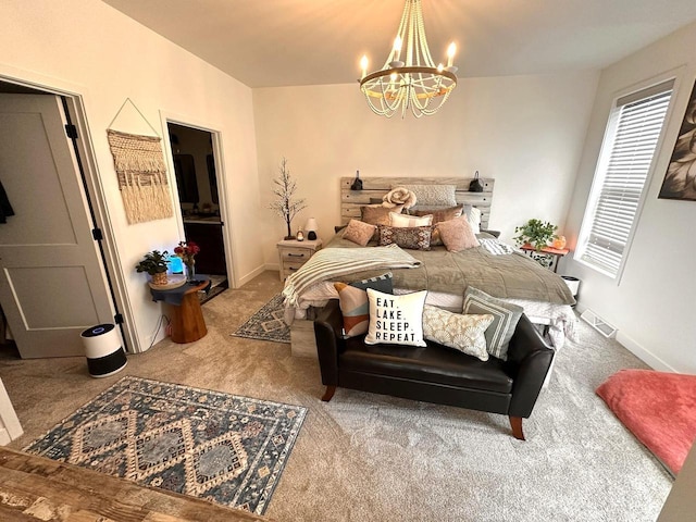 265 Victory Ln, Elkhart Lake, WI 53020 - carpeted bedroom with a chandelier and baseboards