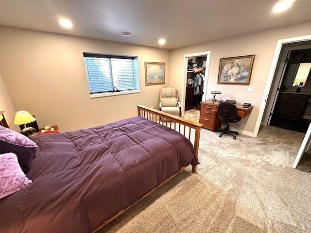 265 Victory Ln, Elkhart Lake, WI 53020 - bedroom with light carpet, recessed lighting, a desk, a spacious closet, and a closet
