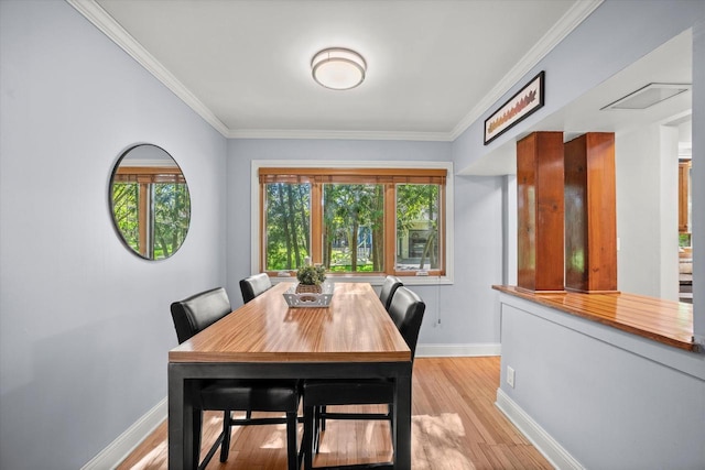 530 W Acacia Rd, Glendale, WI 53217 - dining area with baseboards, light wood finished floors, and crown molding