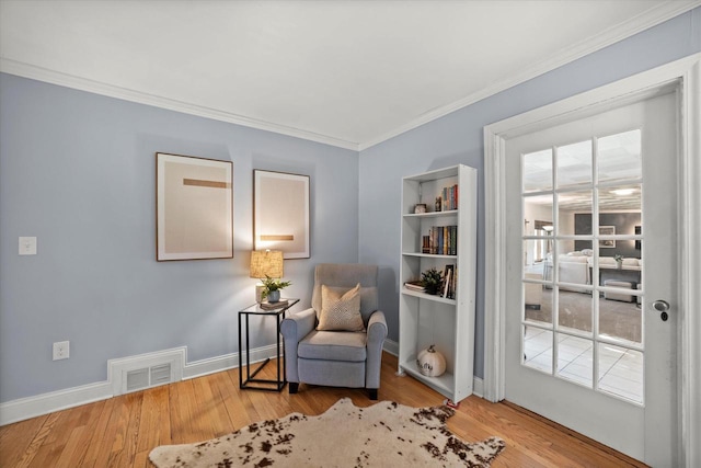 530 W Acacia Rd, Glendale, WI 53217 - sitting room with crown molding, wood finished floors, and baseboards