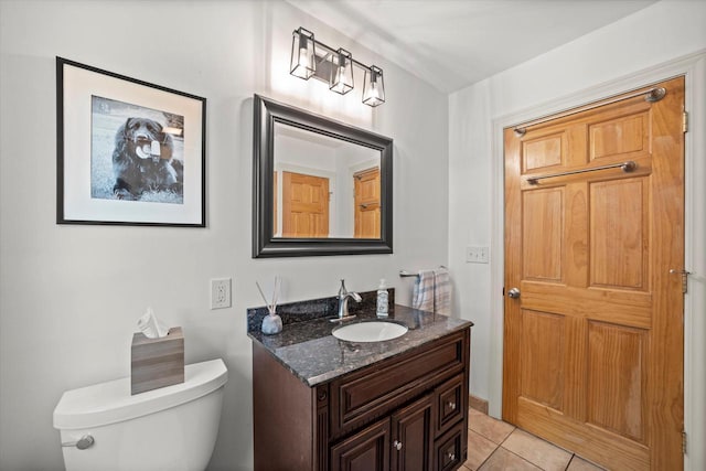 530 W Acacia Rd, Glendale, WI 53217 - half bathroom with tile patterned flooring, toilet, and vanity